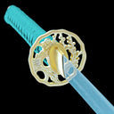Flower-engraved copper tsuba close-up on the Verdant Thorn Damascus katana