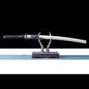 Sylvan Drake 1065 steel blade displayed with its matching saya