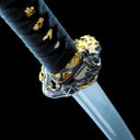 Black-wrapped ray skin handle beside the dragon-motif tsuba