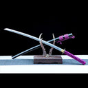 Amethyst Fang katana crossed over its black urushi-lacquered saya