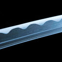 Close-up of genuine multilayer forged Damascus pattern along the katana blade