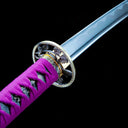 Openwork alloy tsuba and purple ray-skin handle close-up