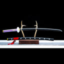Kikoku replica displayed horizontally with black painted wood saya
