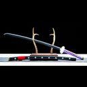 Full side view of Kikoku replica beside its black wood saya