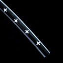 Close-up of white cross decorations on the black painted saya