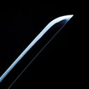 Polished point and curved edge of the 1060 carbon steel blade