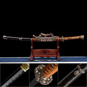 Sheathed Dragonheir Tachi on wooden stand with inset macro shots of wavy Hamon line, copper Tsuba, and gold-flecked Saya