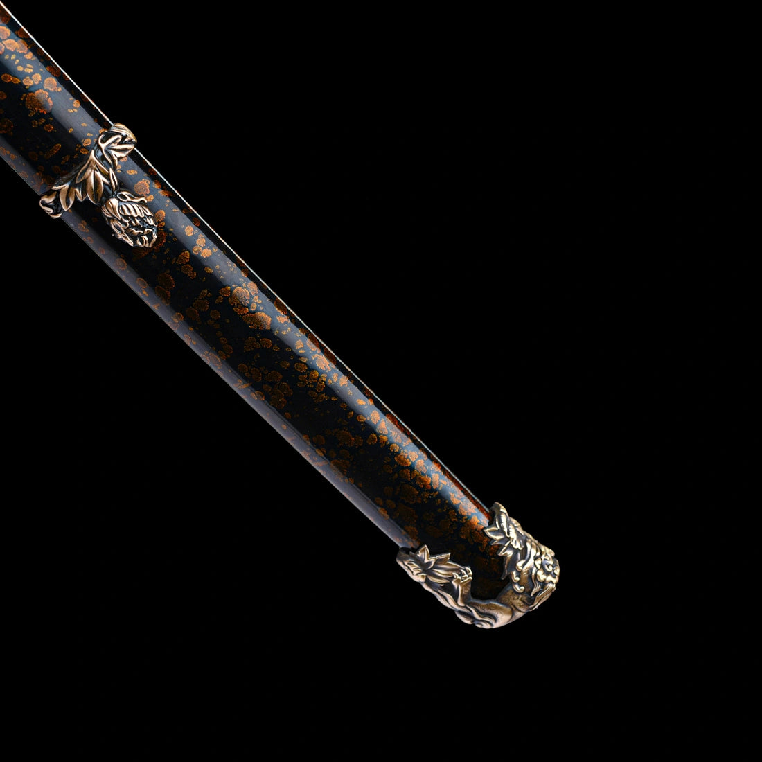Detailed view of gold-flecked black lacquered wood Saya scabbard with relief copper Kojiri end cap on Dragonheir Tachi