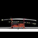 Unsheathed 1065 high carbon steel Murasame tachi sword blade resting above lacquered scabbard