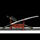 Unsheathed hand-forged 1065 high carbon steel Murasame tachi sword blade parallel with scabbard on stand