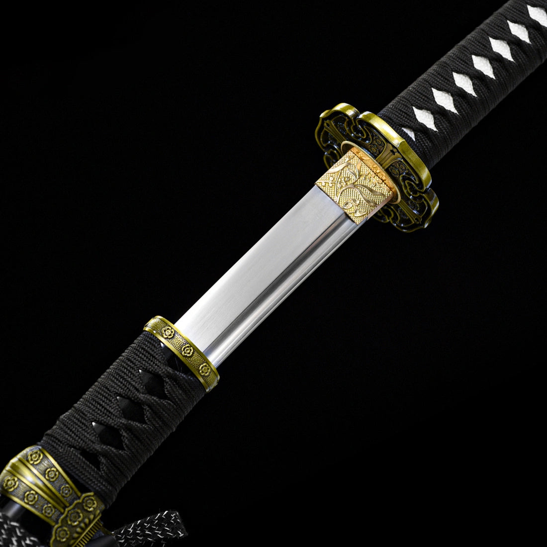 Intricate floral engraved habaki collar and black wrapped handle joint on high toughness Murasame tachi sword