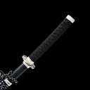 Ergonomic black wrapped tsuka handle featuring precision-cast silver dragon fittings on Oblivion Fang tachi