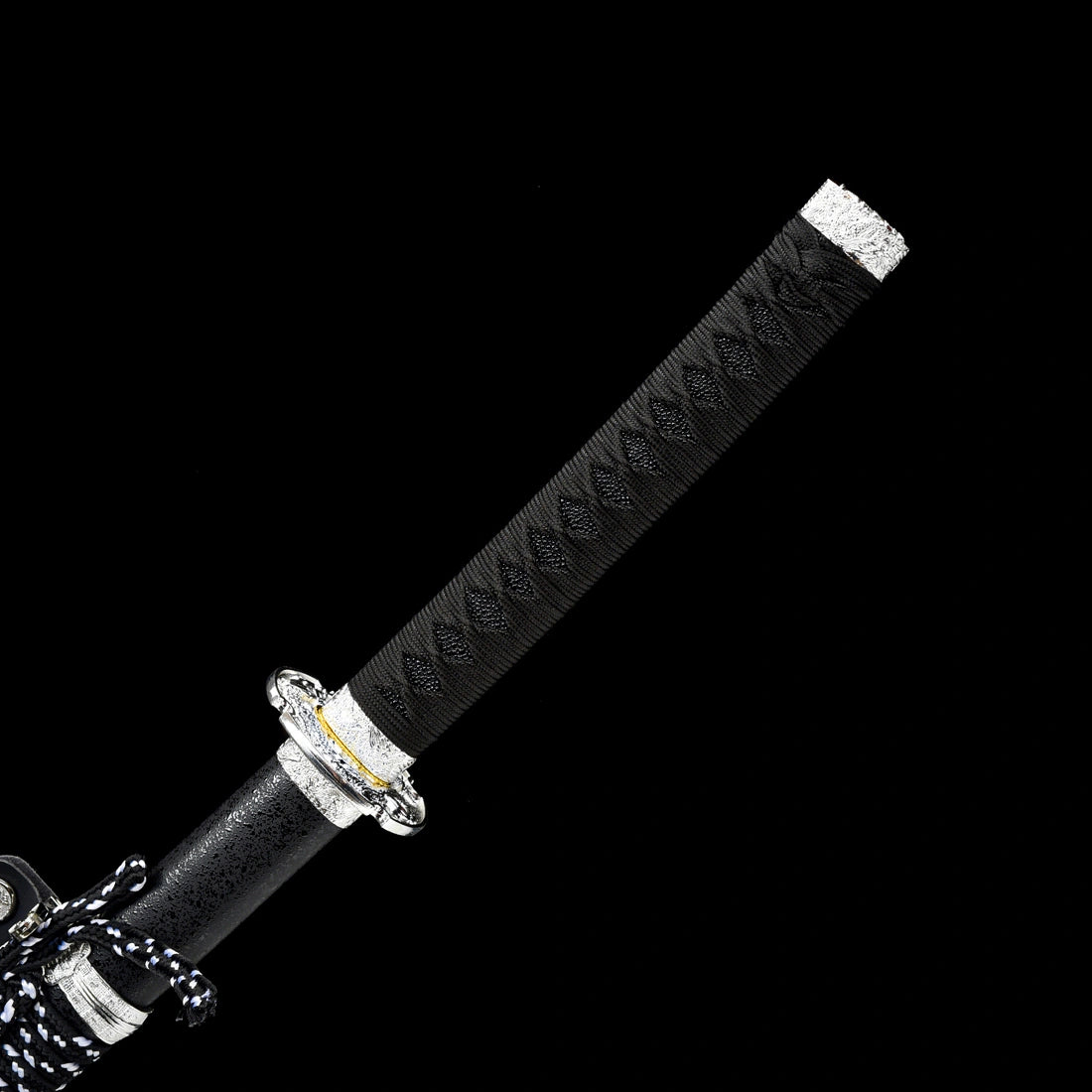 Ergonomic black wrapped tsuka handle featuring precision-cast silver dragon fittings on Oblivion Fang tachi