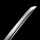Precision-machined acoustic bo-hi blood groove and razor-sharp kissaki tip on 60 HRC Damascus tachi blade