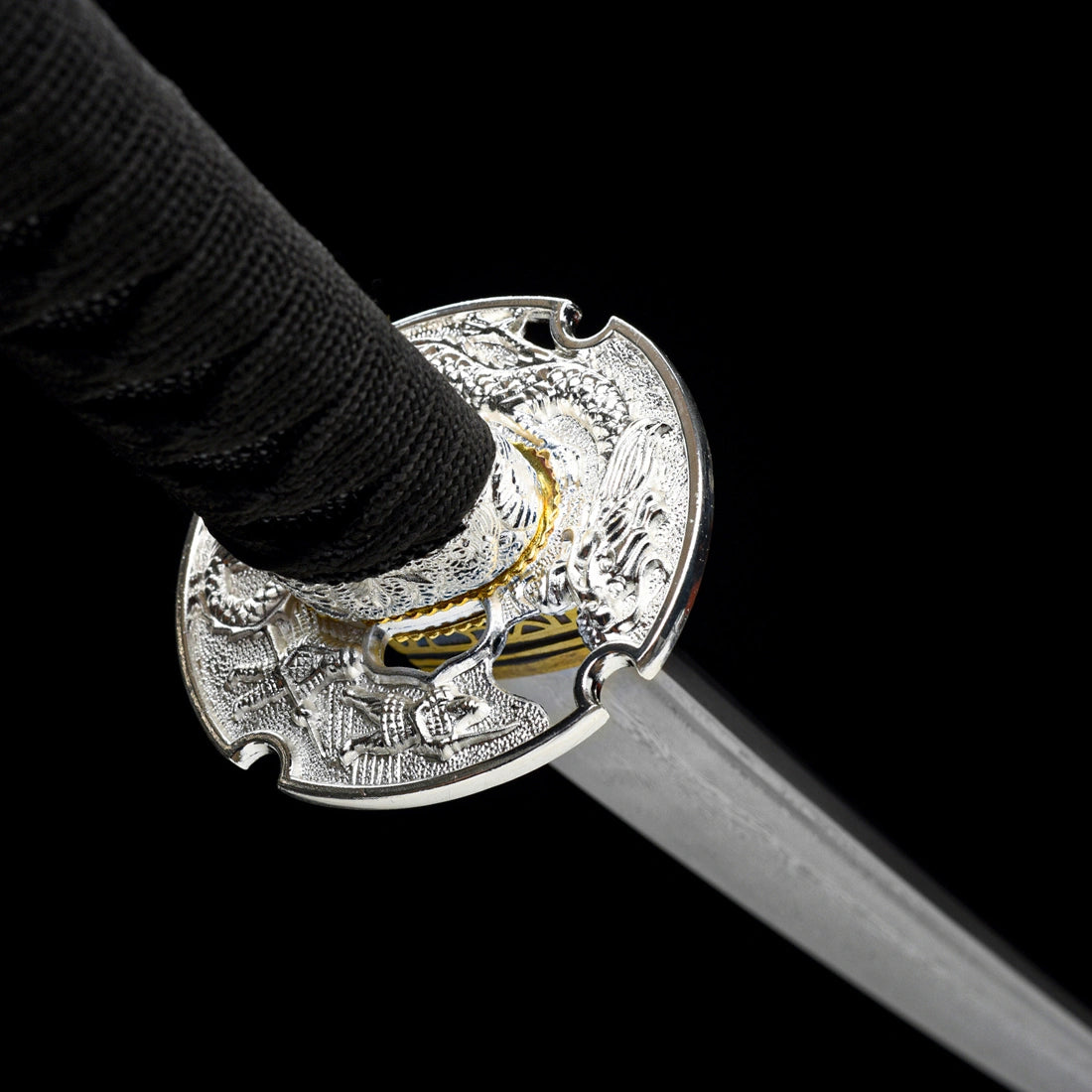 Precision-cast openwork silver dragon tsuba guard providing hand protection on Oblivion Fang tachi sword