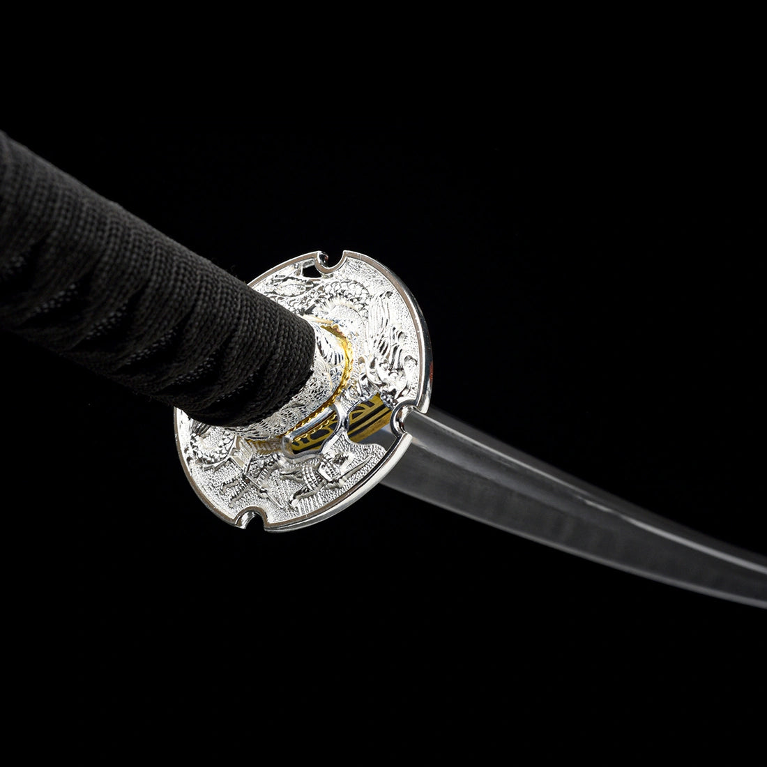 Perspective view of openwork silver-plated dragon tsuba guard mounted on Oblivion Fang hand-forged tachi