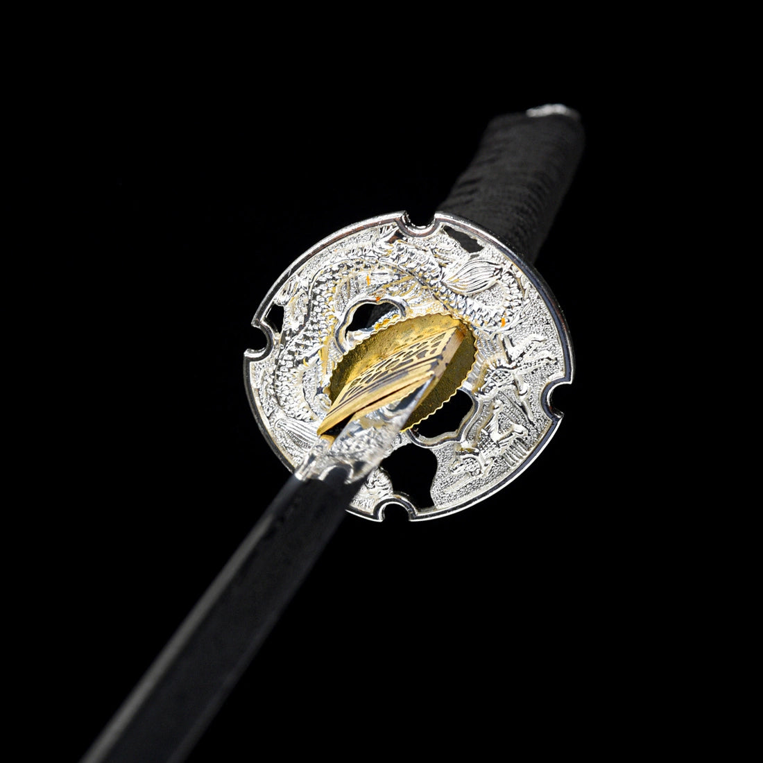 Openwork silver-plated dragon tsuba guard paired with textured gold habaki collar on Oblivion Fang tachi
