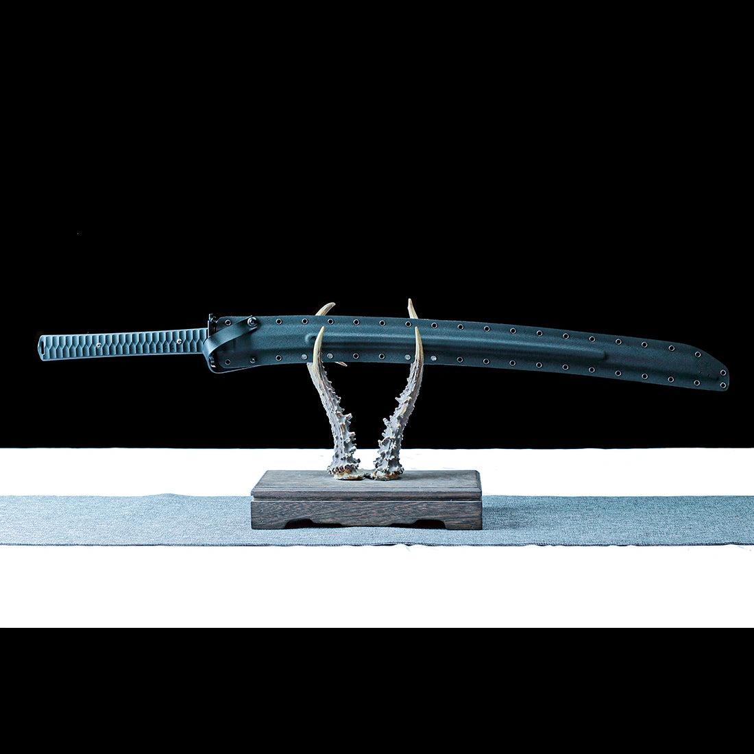 Sheathed Pioneer Tactical Katana displayed with black composite sheath