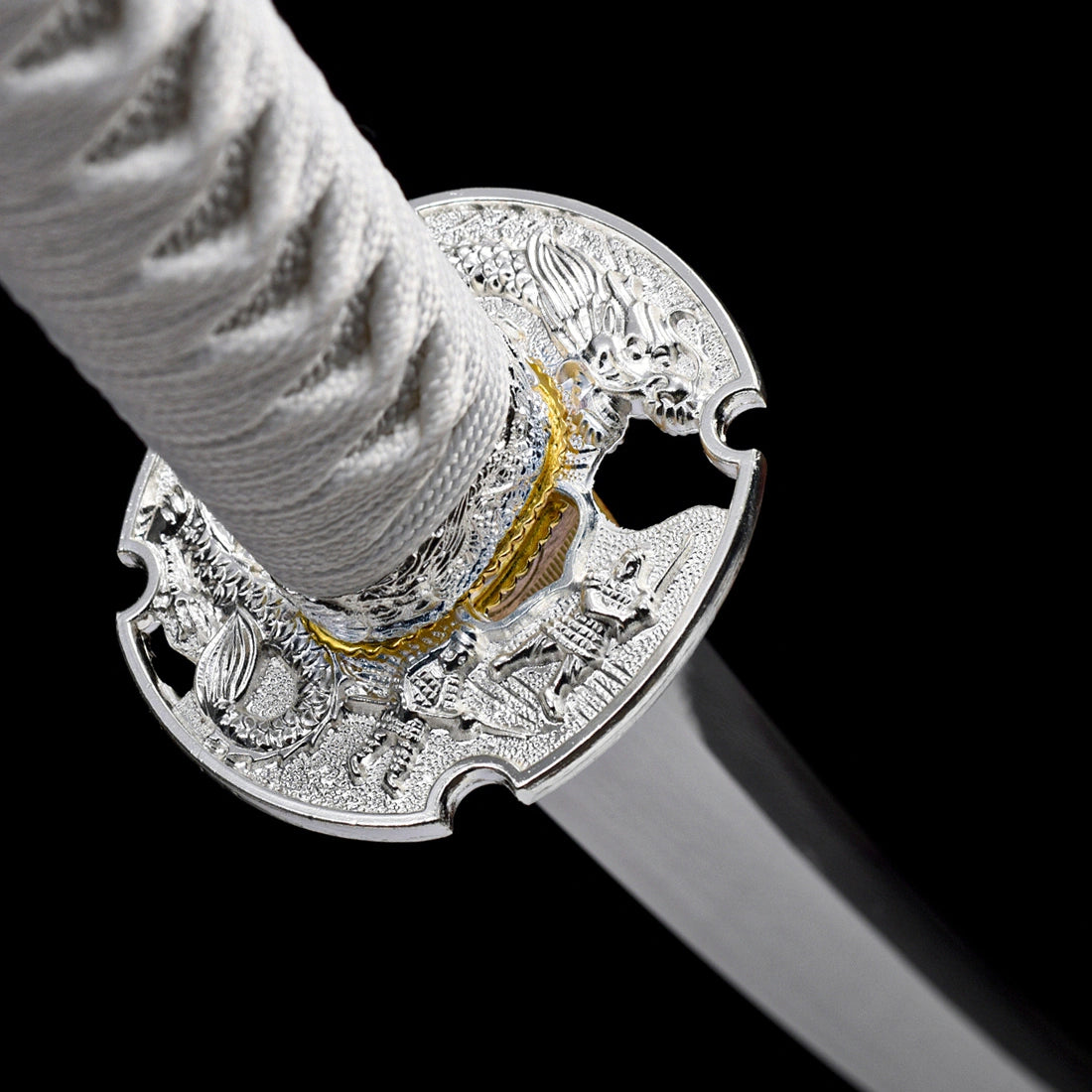 Detailed silver-plated zinc alloy dragon carved tsuba guard on Japanese tachi sword