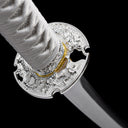 Detailed silver-plated zinc alloy dragon carved tsuba guard on Japanese tachi sword