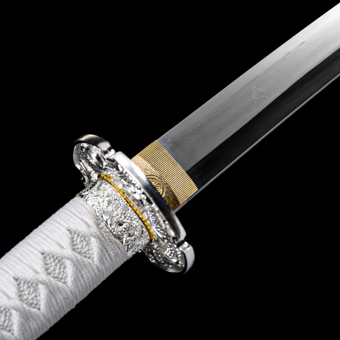 Engraved brass habaki collar and silver-plated dragon tsuba guard on tachi sword