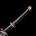 Smooth dark Brazilian ebony handle with hand-carved copper Kashira fitting featuring gold and silver animal inlays on Tyrantclaw Tachi