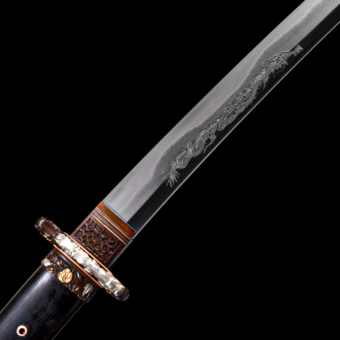 Detailed hand-engraved Dragon Horimono on clay-tempered Wootz steel blade with patterned copper Habaki collar